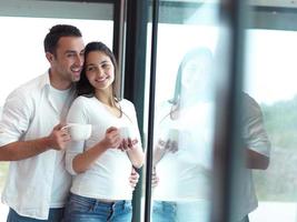 relaxet young couple drink first morning coffee photo