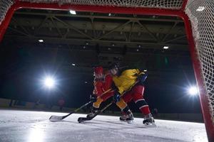 teen ice hockey sport  players in action photo