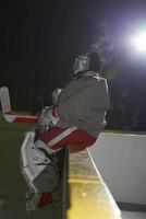 ice hockey players on bench photo