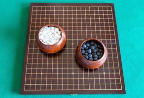 top view of playing stones for Go game in bowls photo