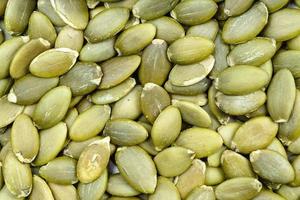 background - many hulled pumpkin seeds photo