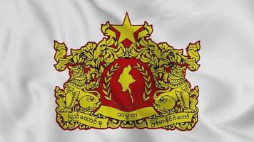 emblema o símbolo nacional de myanmar en la bandera ondeante. bucle suave de video 4k sin problemas
