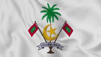emblema o símbolo nacional de Maldivas en la bandera ondeante. bucle suave de video 4k sin problemas