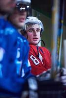 ice hockey players on bench photo