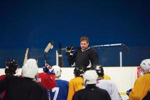 ice hockey players team meeting with trainer photo