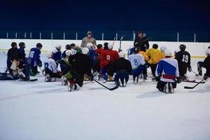 ice hockey players team meeting with trainer photo