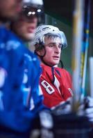 ice hockey players on bench photo