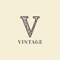 diseño de vector de logotipo de decoración vintage de letra v