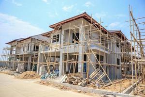 house under construction with autoclaved aerated concrete block structure at building site photo