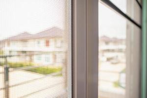 mosquito net wire screen on house window protection against insect photo