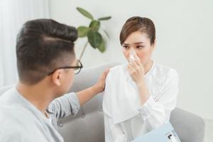 Unhappy patient speaking with doctor in medical office photo