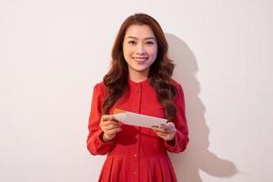 Lovely female with red heart isolated on gray background, celebration of Valentine day, romantic feelings, harmony and love concept photo