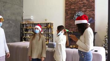 People at a holiday party celebrate together wearing santa hats video