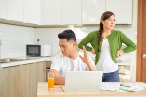 Couple arguing about money at home. Problems in relationship photo