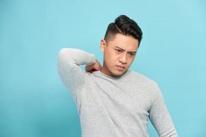 Asian man having a shoulder pain photo