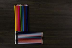 Colored pencils on blue background. with copy space for text design photo