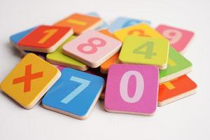 Number wood block cubes for learning Mathematic, education math concept. photo