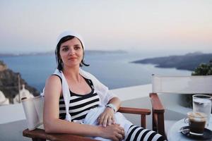 Greek woman on the streets of Oia, Santorini, Greece photo