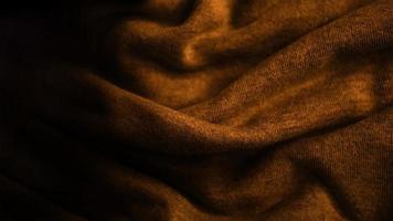 elegant premium gold cloth texture with black background photo