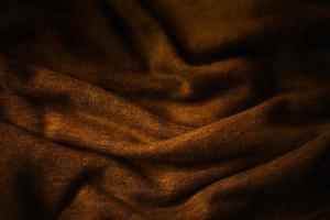 elegant premium gold cloth texture with black background photo