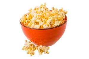 Popcorn in a bowl isolated on white photo
