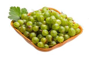 Gooseberry in a bowl on white background photo