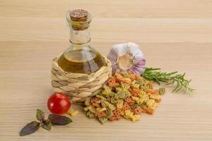 Kids pasta on wooden background photo