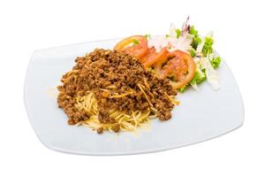 Bolognese pasta on the plate and white background photo