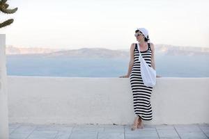 Greek woman on the streets of Oia, Santorini, Greece photo