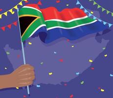 mano con la bandera de sudáfrica vector