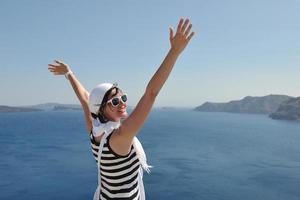 Greek woman on the streets of Oia, Santorini, Greece photo