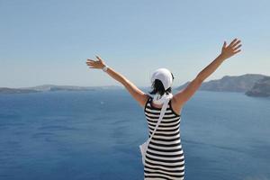 Greek woman on the streets of Oia, Santorini, Greece photo