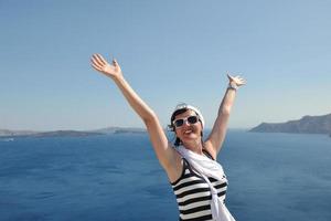 Greek woman on the streets of Oia, Santorini, Greece photo