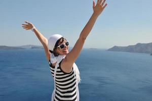 Greek woman on the streets of Oia, Santorini, Greece photo