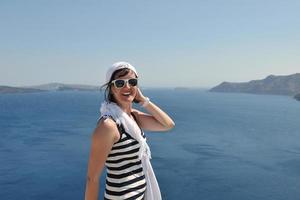 Greek woman on the streets of Oia, Santorini, Greece photo