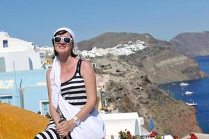 Greek woman on the streets of Oia, Santorini, Greece photo