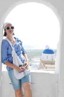 Greek woman on the streets of Oia, Santorini, Greece photo