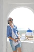 Greek woman on the streets of Oia, Santorini, Greece photo