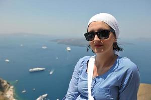 Greek woman on the streets of Oia, Santorini, Greece photo