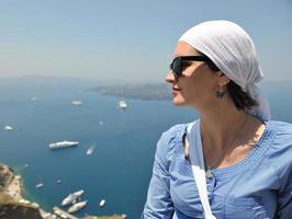 Greek woman on the streets of Oia, Santorini, Greece photo