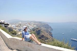 Greek woman on the streets of Oia, Santorini, Greece photo