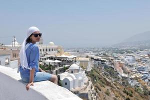 Greek woman on the streets of Oia, Santorini, Greece photo