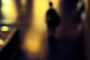 Blurry human silhouette in a subway photo