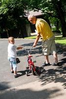 grandfather and child have fun  in park photo