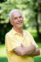 Portrait of smiling elderly man photo