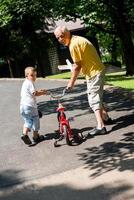 grandfather and child have fun  in park photo