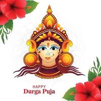 Goddess durga face in happy durga puja subh navratri card background vector