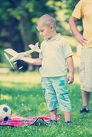 grandfather and child have fun  in park photo