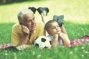 happy grandfather and child in park photo