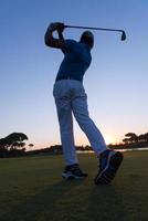 golfer hitting long shot photo